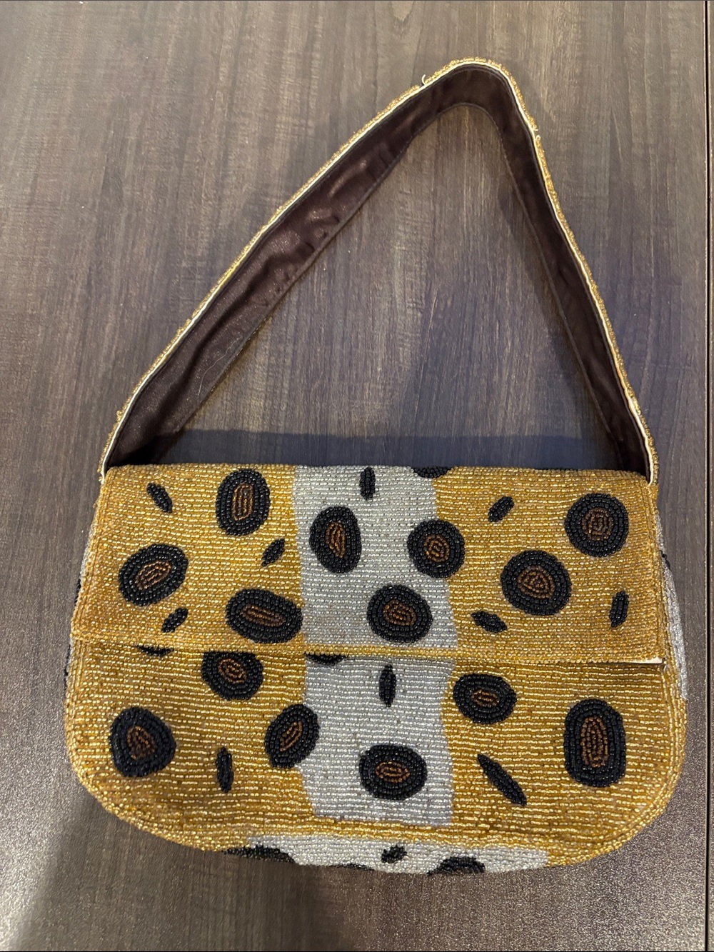 Beaded gold, silver, and black animal print handbag